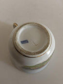 Royal Copenhagen Antike Tasse mit handgemaltem Motiv und Golddekor.