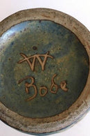 炻器花瓶安装成灯。设计者：Bode Willumsen