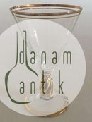 Holmegaard "Ida "酒杯，杯柄、杯缘和杯底均为金色。