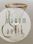 Holmegaard Ida Shot玻璃杯，杯干、杯沿和杯脚都是金色。 