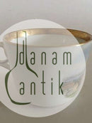 Royal Copenhagen Antike Tasse mit handgemaltem Motiv und Golddekor.