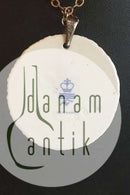 Royal Copenhagen Pendant of porcelain with gold decoration. Designed by Nils Thorson. Sterling Silver by Anton Michelsen