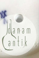 Meissen Figur af siddende dame med blomster