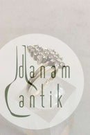 Guldring i 14 K med 16 små sten