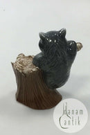 Royal Copenhagen Figurine of Raccoon on tree stump No 054
