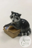 Royal Copenhagen Figurine of raccoon with food basket No 055