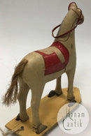 Old toy horse on wheels toy