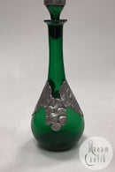 Grüne Weinflasche mit Zinndekoration