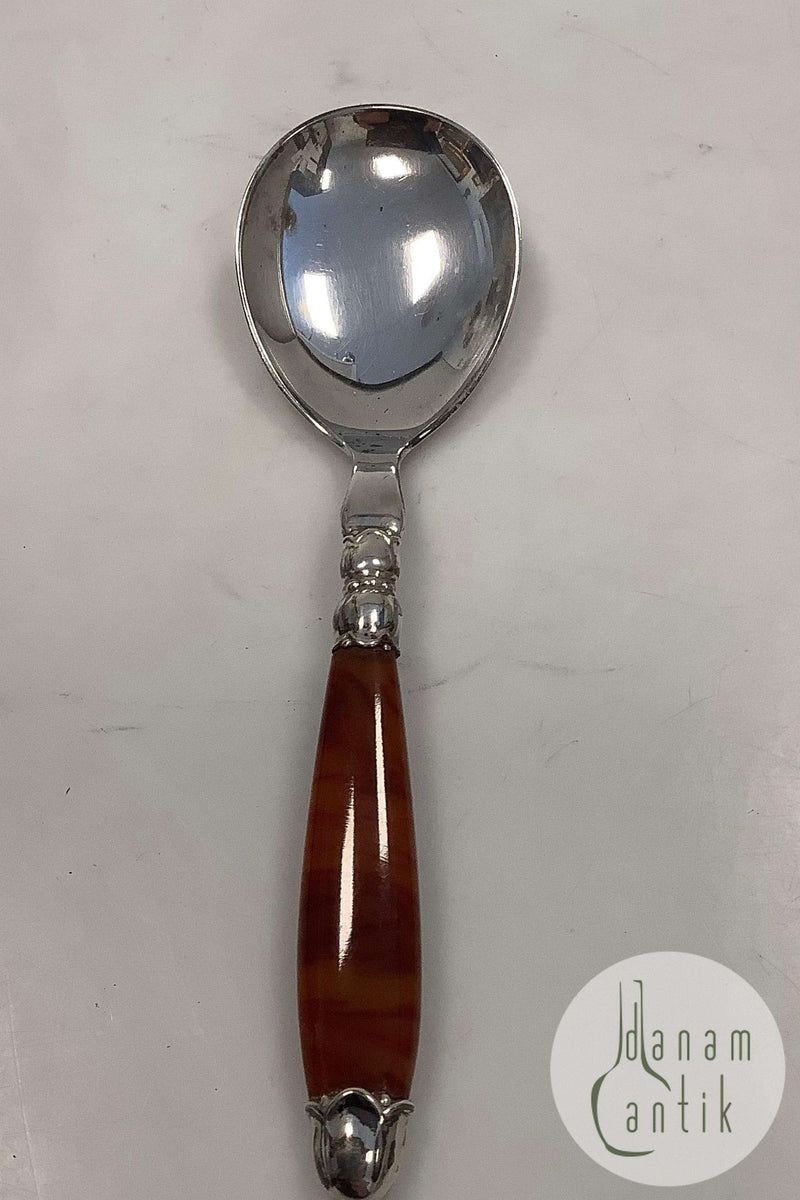 Dansk Ornamental Servingsske med skaft af Immitations Rav