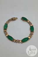 14 karat guld armbånd med grønne sten