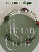 N.E. From armbånd af sterling sølv og rav.