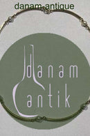 Goldnecklace 14 ct made of 8 slightly curved segments divided by pearls.