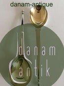 Sæt af to serveringsskeer i Sølv med forgyldt endestykke.