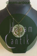 Royal Copenhagen Pendant of porcelain with gold decoration. Designed by Nils Thorson. Sterling Silver by Anton Michelsen