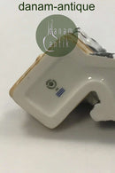 Royal Copenhagen Figurine of raccoon with food basket No 055