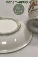 Gammel kop og underkop med dekoration med blomsterguillander og guld