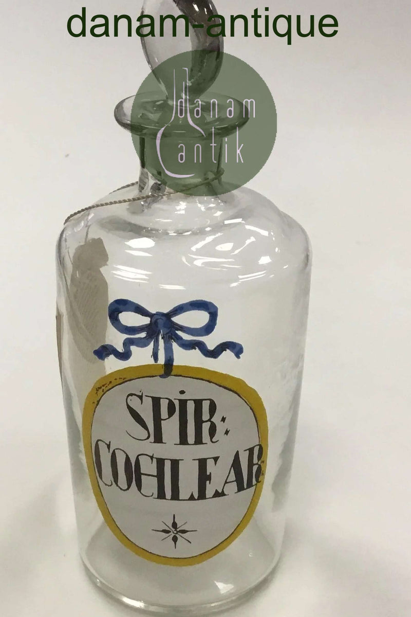 Holmegaard Apotekerflasken, krukke med tekst SPIR COCHLEAR fra 1981