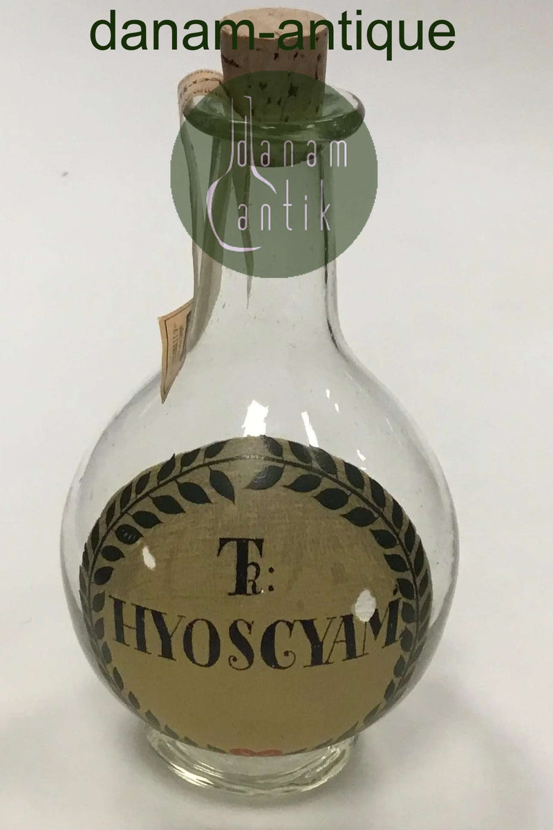 Holmegaard Apotekerflasken, krukke med tekst TR KYOSCYAM fra 1984
