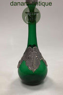 Grüne Weinflasche mit Zinndekoration