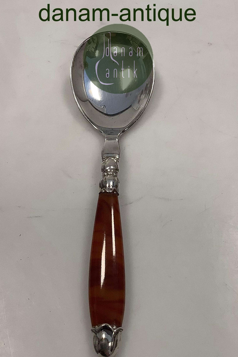 Dansk Ornamental Servingsske med skaft af Immitations Rav