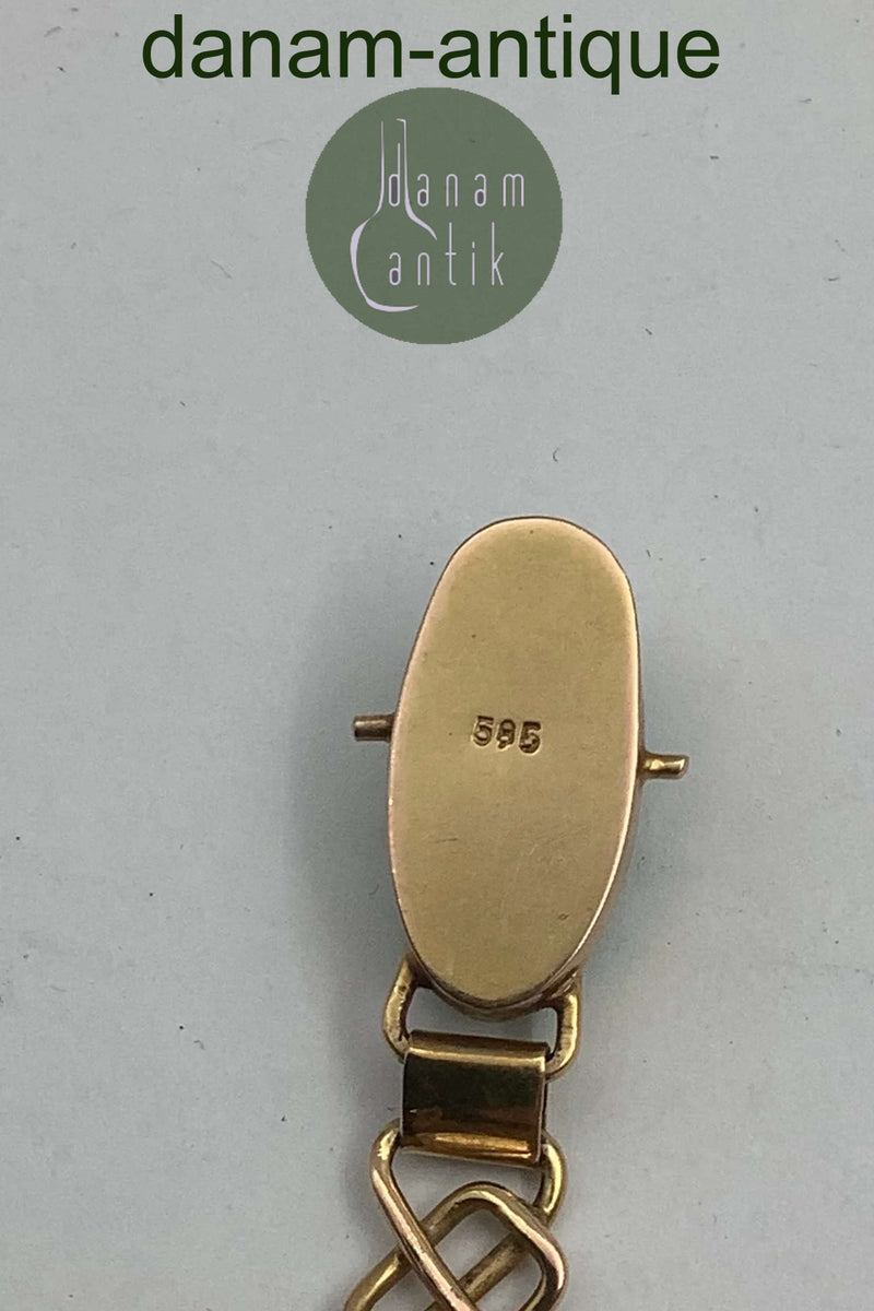 14 karat guld armbånd med grønne sten