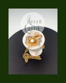 Royal Copenhagen Pendant of porcelain with gold decoration. Designed by Nils Thorson. Sterling Silver by Anton Michelsen