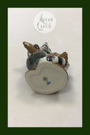 Royal Copenhagen Figurine of Raccoon on tree stump No 054
