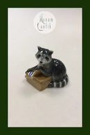 Royal Copenhagen Figurine of raccoon with food basket No 055