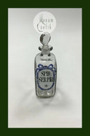 Holmegaard Apotekerflasken, krukke med tekst SPIR SERPILL fra 1990