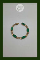 14 karat guld armbånd med grønne sten