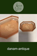 Salt vessel made in light brown glass.