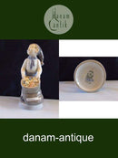 Royal Copenhagen Figur December Dreng med sæk No 4534