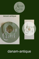 Royal Copenhagen Vedhæng af porcelæn med gulddekoration. Designet af Nils Thorson