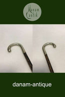 Antique German walking stick with a head of silver, stamped silber. Shaft of black painted wood. Modern ferule of black rubber.