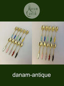 Ein Satz von 10 Kaffeelöffeln aus Silber und Emaille von Frigast