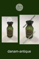 Holmegaard Apotekerflasken, krukke med tekst Nuces Moschatæ fra 1985