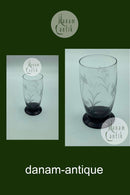 Holmegaard Glasværk: ørneglas eller sodavandsglas på sort fod med slibninger