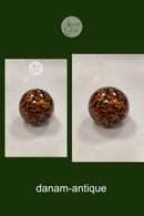 Orangefarbene Buchstabenwaage aus Glas