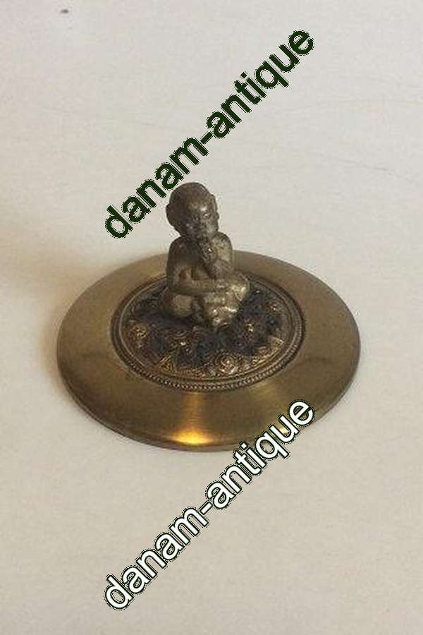 Messinglåg med Bacchus figur