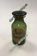 Holmegaard Apotekerflasken, krukke med tekst Nuces Moschatæ fra 1985