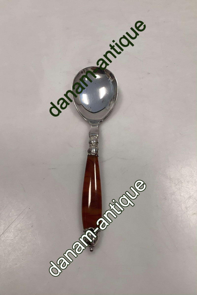 Dansk Ornamental Servingsske med skaft af Immitations Rav