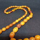 Antik Opak butterscotch oliven slebet ravkæde 72 cm. - Danam Antik