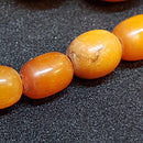 Antik Opak butterscotch oliven slebet ravkæde 72 cm. - Danam Antik