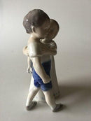Royal Copenhagen Figurine No 406 af Pige der Krammer Dreng - Danam Antik