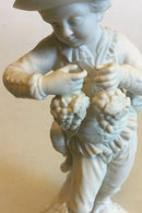 Royal Copenhagen Bisquitfigur af dreng med drueklaser - Danam Antik