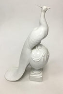 Royal Copenhagen figur af påfugl på kugle - Danam Antik